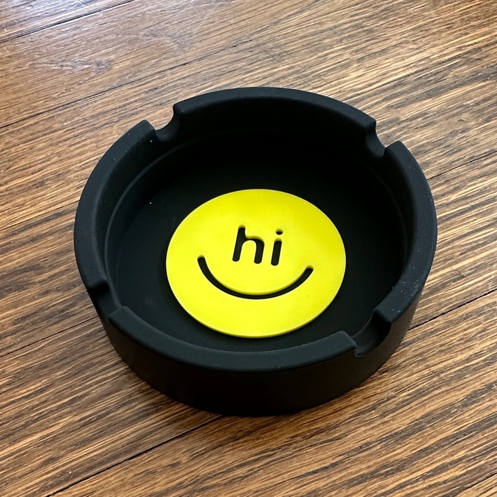 Black Plastic Ashtray with Yellow Smiley Design